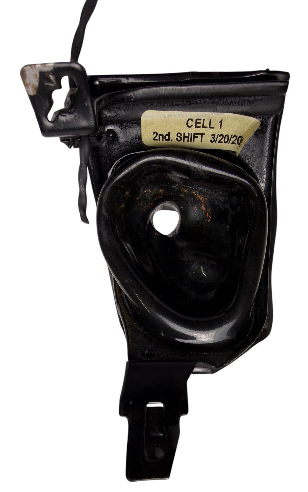 Black mechanical component with a label on a white background