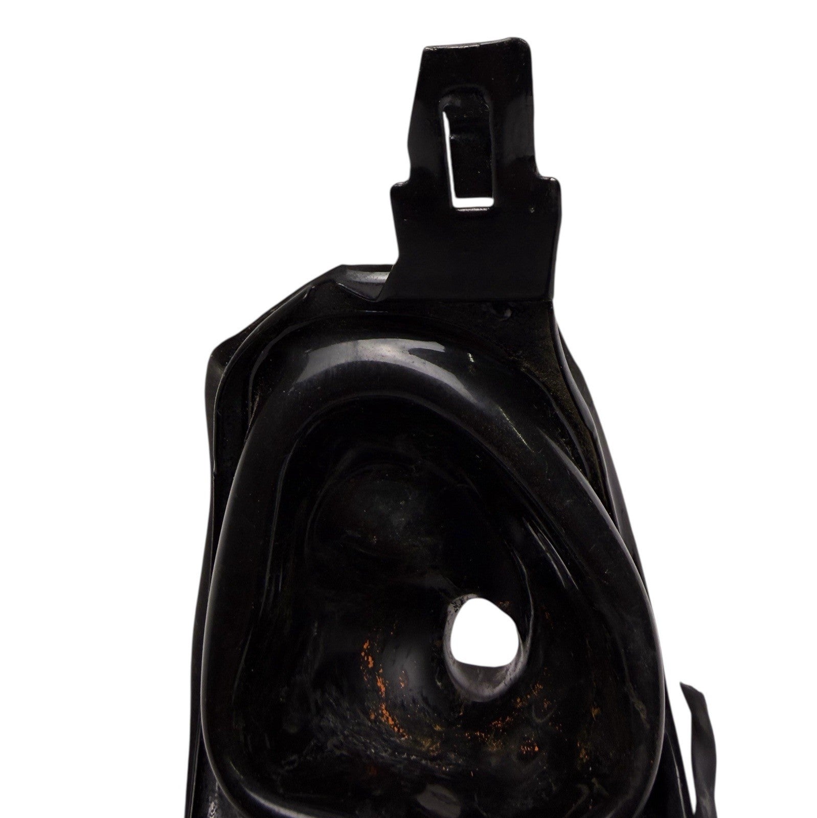 Black plastic car part on a white background